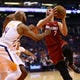 Miami Heat guard Goran Dragic (7) drives to the basket against Phoenix Suns guard Jevon Carter (4) in the second half on Nov. 7, 2019 in Phoenix, Ariz.