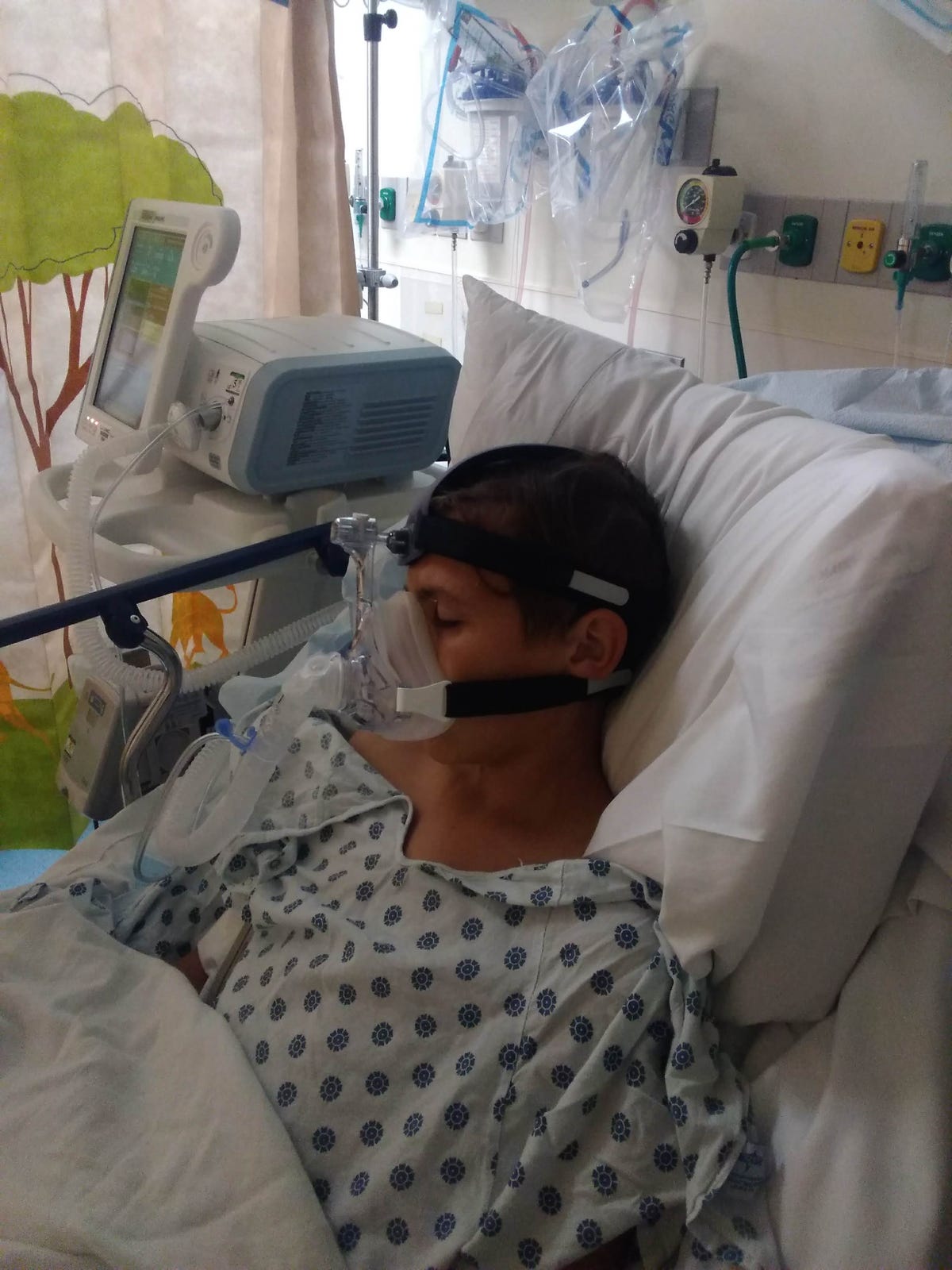teenage boy in hospital bed