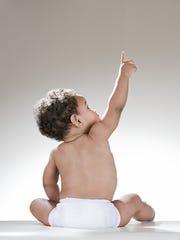 Baby in diaper stock image.