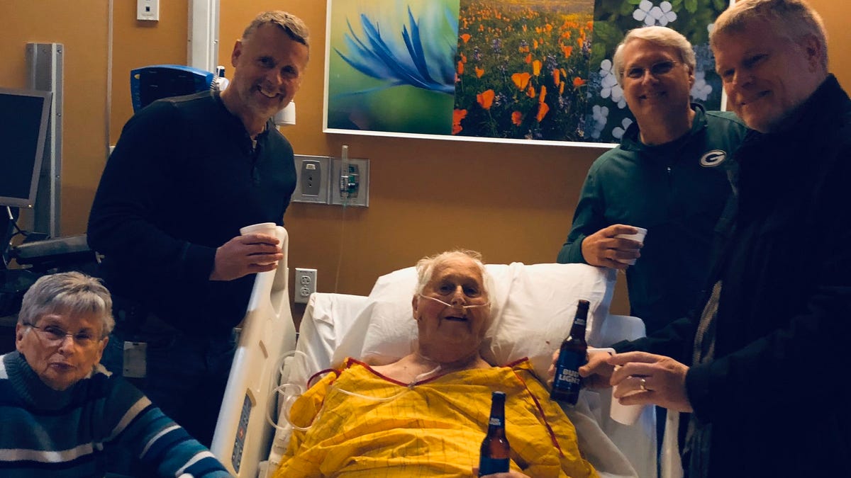 Norber Schemm, center, with his wife, Joanne, clockwise from left, and sons Bob, Tom and John.