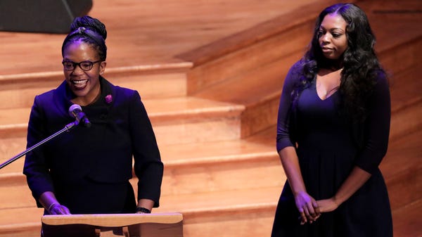 Jennifer Cummings, left, daughter of the late Rep.