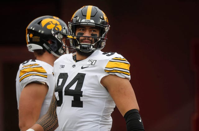 Iowa junior defensive end A.J. Epenesa looks out over the field prior to kickoff against Nebraska during their Big 10 final season game on Friday, Nov. 29, 2019, at Memorial Stadium in Lincoln, Neb.