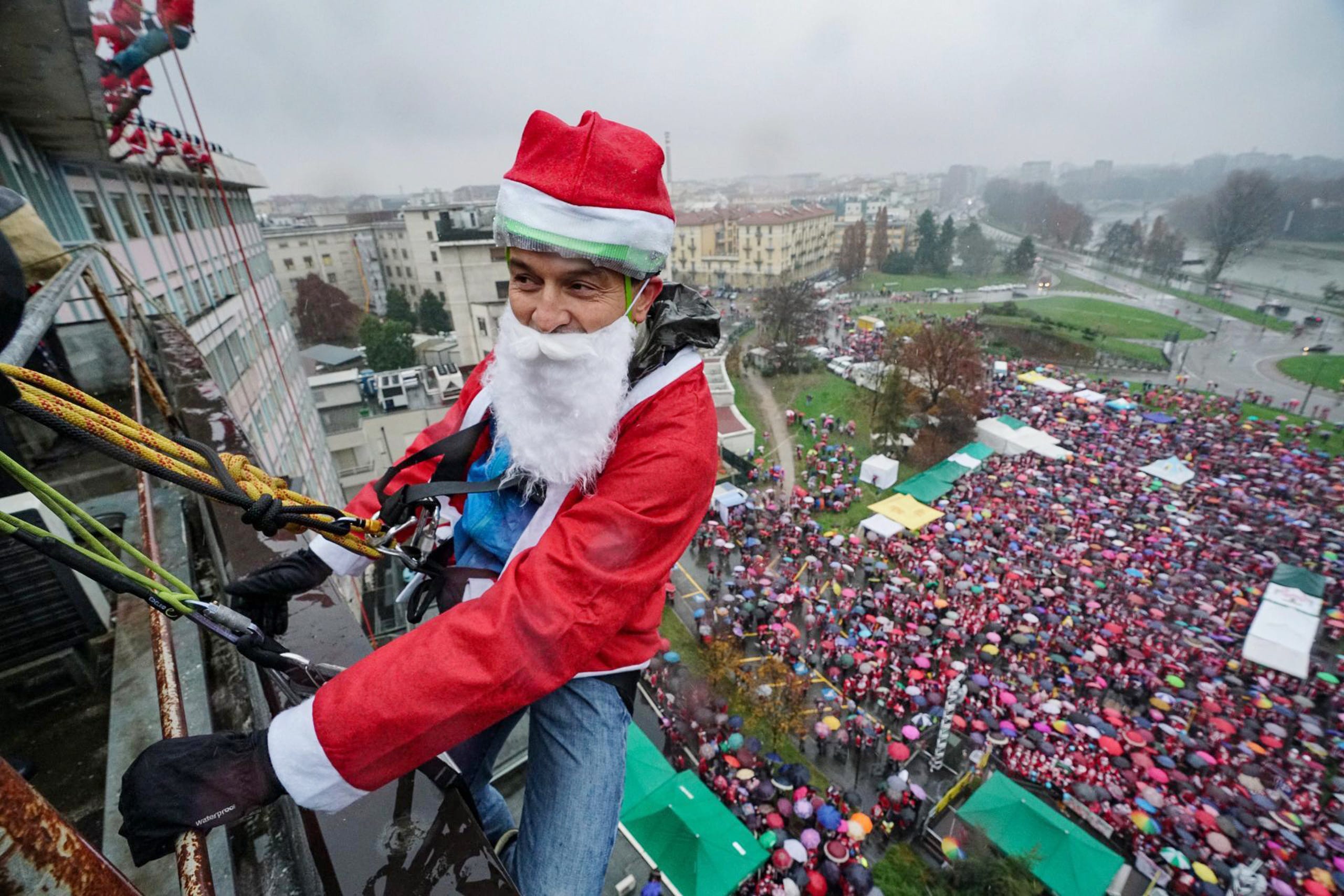 A man dressed as Santa Claus greets sick children at the Regina Margherita hospital in Turin, Italy on Dec. 1, 2019. 