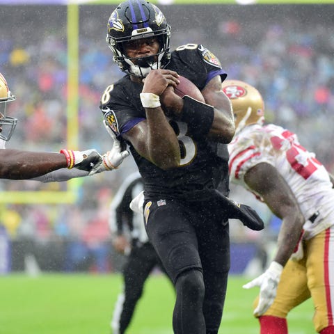 Baltimore Ravens quarterback Lamar Jackson scores 