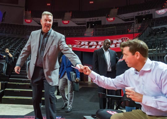 UL women's basketball coach Garry Brodhead bumps fists with athletic director Bryan Maggard during a game against Mississippi State this season.