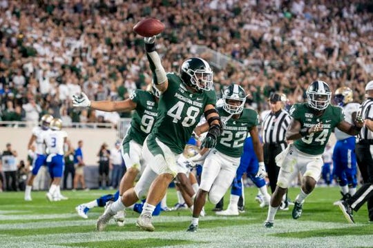 Michigan State defensive end Kenny Willekes, celebrating a touchdown in the opener against Tulsa, had nine sacks this season.
