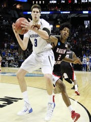 Elfrid Payton tries to steal the ball from National Player of the Year Doug McDermott during UL's 2014 NCAA Tournament game against Creighton.