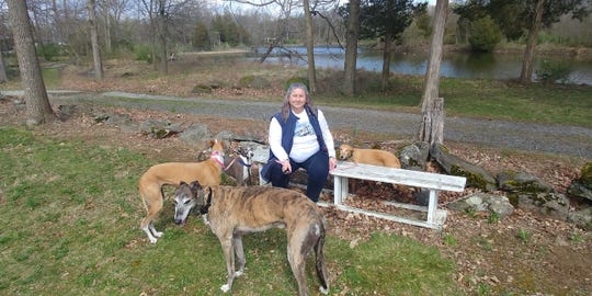 Anne Thimm, a retired analyst from Alexandria, Virginia is glad the Mustang Mach-E will hold her dogs: Truman, a retired racing greyhound; Tina, a Spanish Galgo; and whippets, Bambi and Remi. The photo was taken in Spring 2017 in Lake Anna, Virginia.