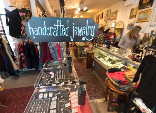 Jewelry and clothes are displayed Tuesday at Uncommon Items, which is having a moving sale.