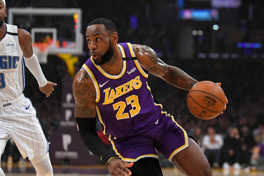 Los Angeles Lakers forward LeBron James drives toward the basket during the first half of an NBA basketball game against the Orlando Magic Wednesday, Jan. 15, 2020, in Los Angeles. (AP Photo/Mark J. Terrill)