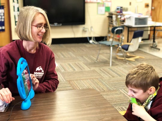 Lizzy Revans, special education teacher, with student Mace Headrick at Dogwood Elementary School on Jan. 22, 2020.