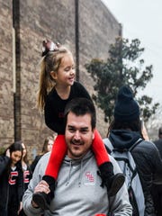 Knoxville Central Bobcats defensive coordinator Nick Craney with daughter Lilly, during the pep rally on Dec. 6, 2019, at Central High School, Knoxville.