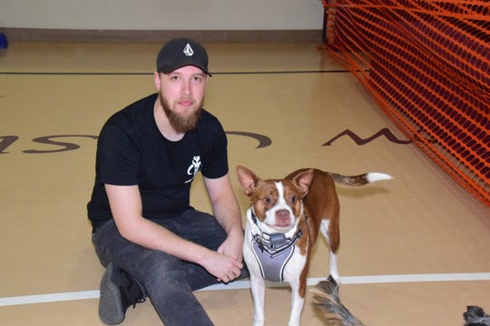 Anthony McDaneld with Ledger the Boston Terrier at the second annual Paw Party held at West Towne Christian Church on Saturday, Jan. 18. “He’s a little dog, but a big dog at heart,” said McDaneld. 2020