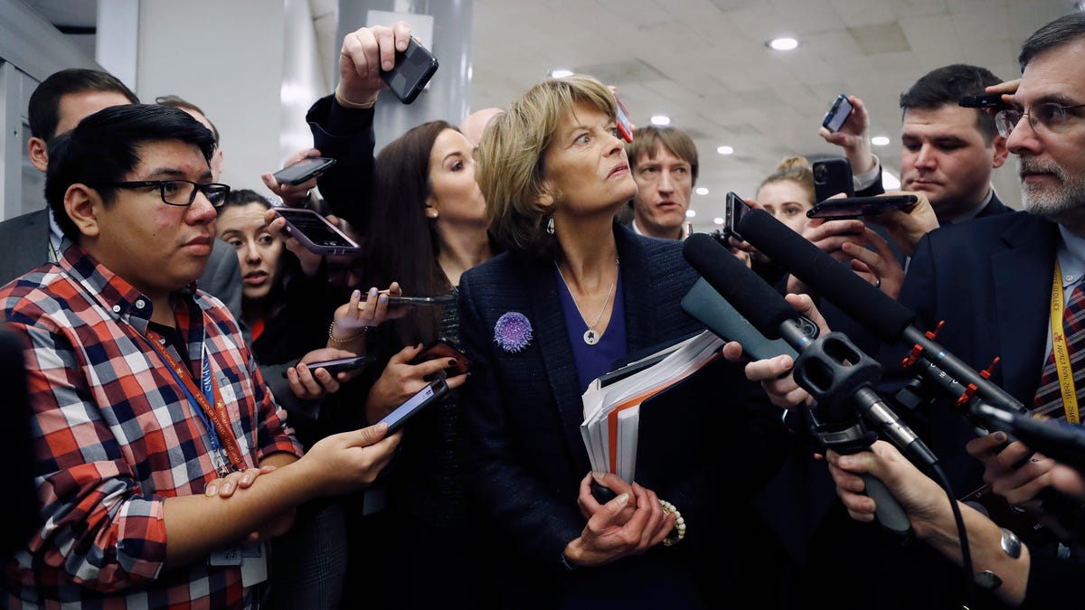 Sen. Lisa Murkowski, R-Alaska, talks with reporters as in the basement of the U.S. Capitol in Washington, Thursday, Jan. 30, 2020, while leaving at the end of a session in the impeachment trial of President Donald Trump on charges of abuse of power and obstruction of Congress.