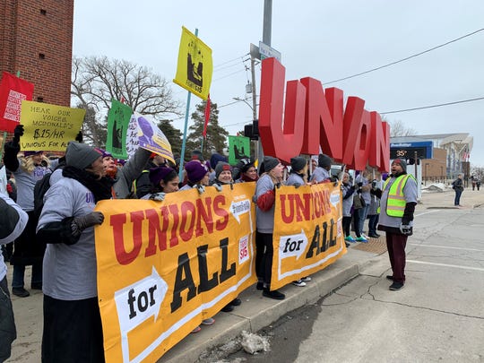 Demonstrators from the Fight for 15 movement gathered outside the corner of Forest Avenue and 27th Street in Des Moines, Iowa, on Monday, Feb. 3, 2020, to demand a $15 an hour minimum wage and union rights.