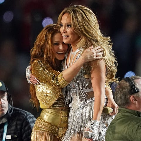 Jennifer Lopez and Shakira share a hug after the h