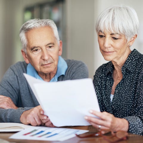 Cropped shot of a senior couple going through thei