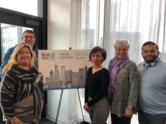 (Left to right) Marge Drozd, of Saint Peter’s University Hospital; John Dowd, of the Middlesex County Office of Health Services; Ana Bonilla, program coordinator of the New Brunswick Healthy Housing Collaborative; Mariam Merced, of Robert Wood Johnson University Hospital; and Manuel Castaneda, of New Brunswick Tomorrow.