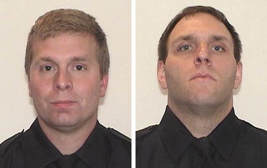 Milwaukee Police Officers Robert Parks, left, and Adam Maritato