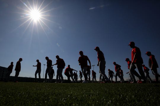 Cincinnati Reds pitchers participate in drills during spring practice, Thursday, Feb. 20, 2020, at the baseball team's spring training facility in Goodyear, Ariz. 