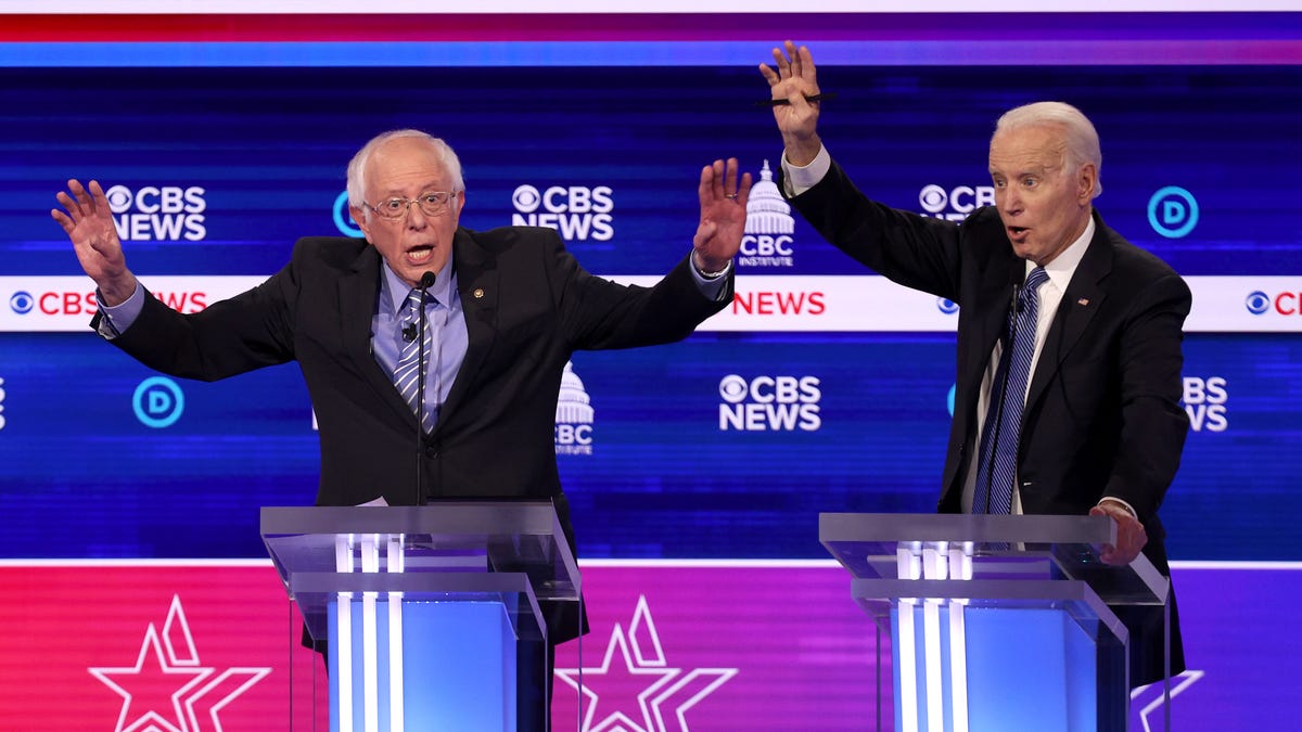 Democratic presidential candidate Sen. Bernie Sanders speaks as former Vice President Joe Biden reacts during the Democratic presidential primary debate.