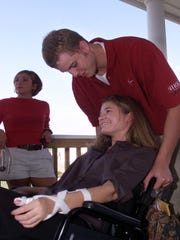 Luke Recker and girlfriend Kelly Craig shared an intimate moment on the front porch at Plum Creek Golf Course in Carmel Sept. 28,1999.