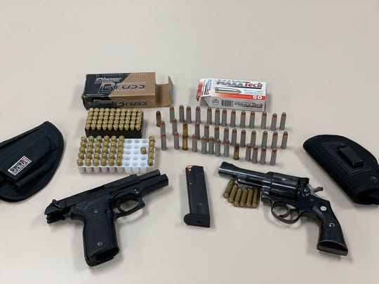 Firearms and ammunition seized during a search warrant in Ventura on Friday.