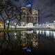 The Renaissance Center, home to the world headquarters of General Motors Co., is reflected near Hart Plaza.