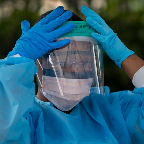 Healthcare worker Ludnie Emile prepares to test pe