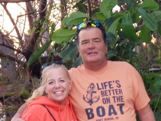 Natalie Farquhar, pictured here with husband Scott outside Le Tub Saloon in Hollywood, Fla., in January, was sent home from work at the Fiat Chrysler parts distribution center in Center Line. She was told the company needed to deep clean after a worker tested positive for coronavirus.