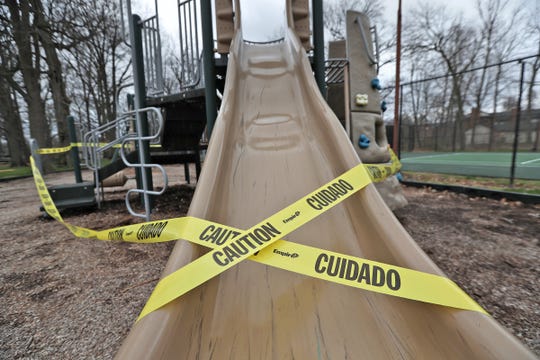 Caution tape indicates that the College Park neighborhood playground is closed on March 31.