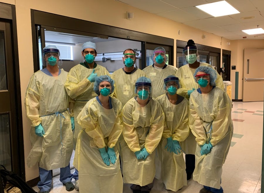 "We can beat this, and we will," says registered nurse Chad Brewer, back middle, part of the COVID-19 unit at Regional One Hospital in Memphis, Tenn.