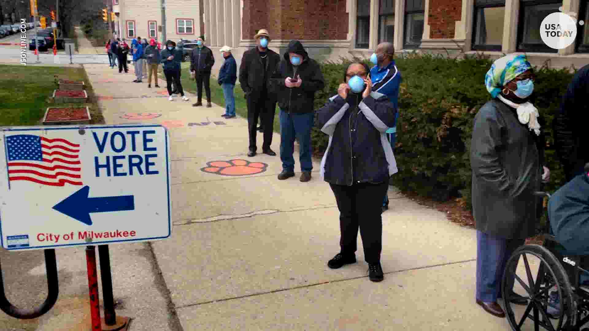 Primary election voters in Wisconsin keep social distance in long lines