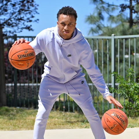 Jordan Montgomery shoots baskets on a half court i