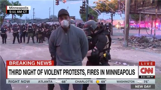 In this screengrab from CNN, reporter Omar Jimenez is detained by police officers on May 29, 2020 in Minneapolis.