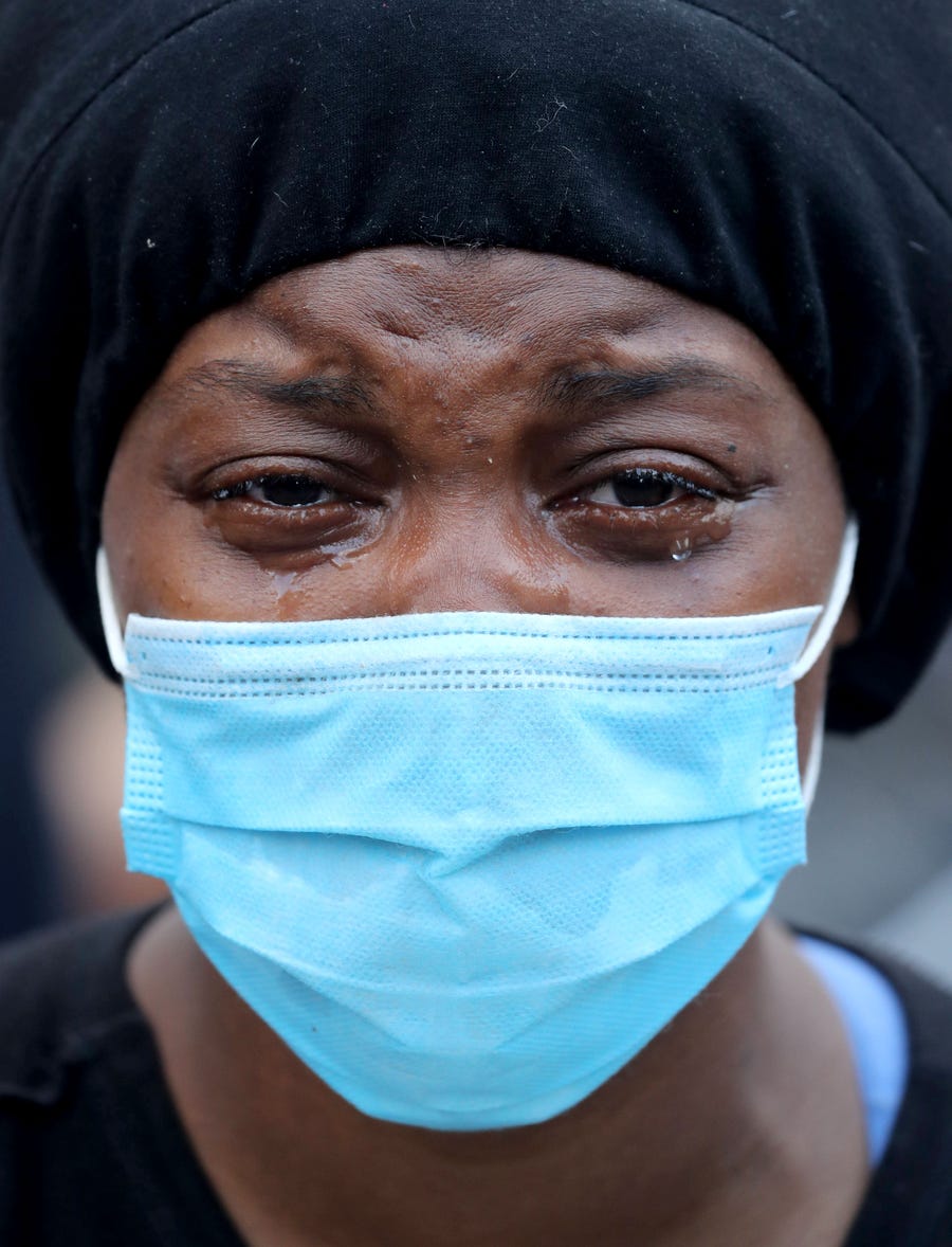 A woman tearfully joins protesters at Union Square in Manhattan on May 30.