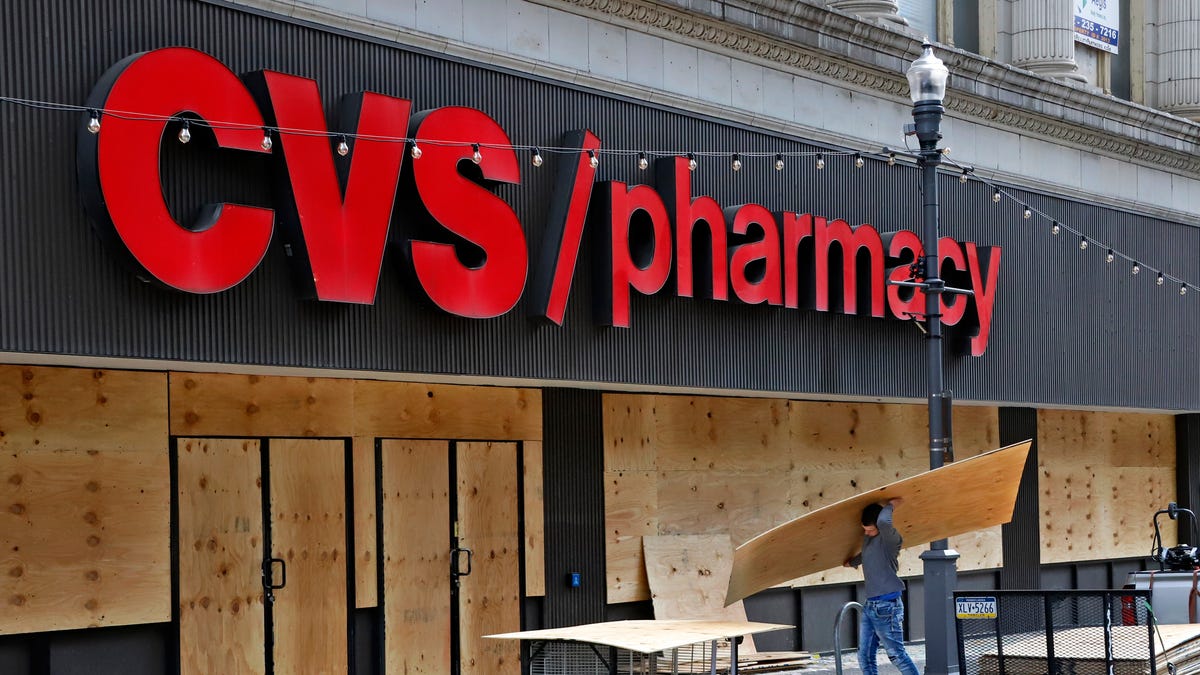 Windows broken in a downtown Pittsburgh CVS Pharmacy are boarded up on May 31, 2020.