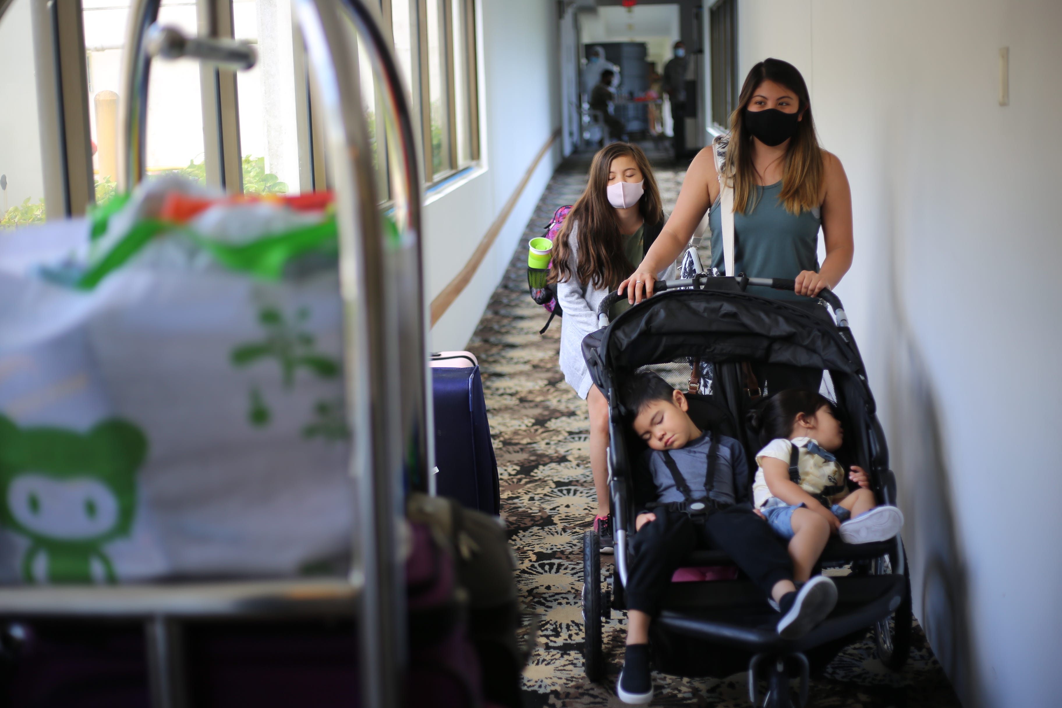 Aiesha Perez, with her children Aleiyah Perez, 10, Dre Pagarao, 3, and Keanu Pagarao, 2 leave the Oceanview Hotel quarantine facility in Tumon on June 1, 2020. They transitioned to home quarantine.