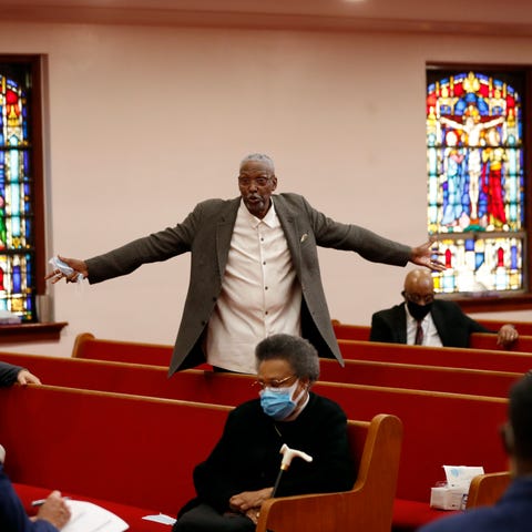 Bishop Thomas Wesley Weeks stands as he speaks to 