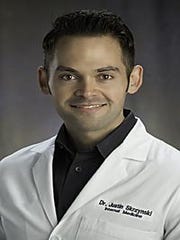 Dr. Justin Skrzynski, an internal medicine physician at Beaumont Hospital in Royal Oak.