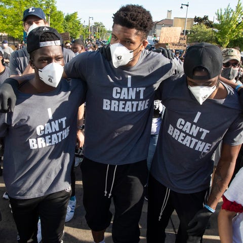 Giannis Antetokounmpo and Bucks teammates march wi