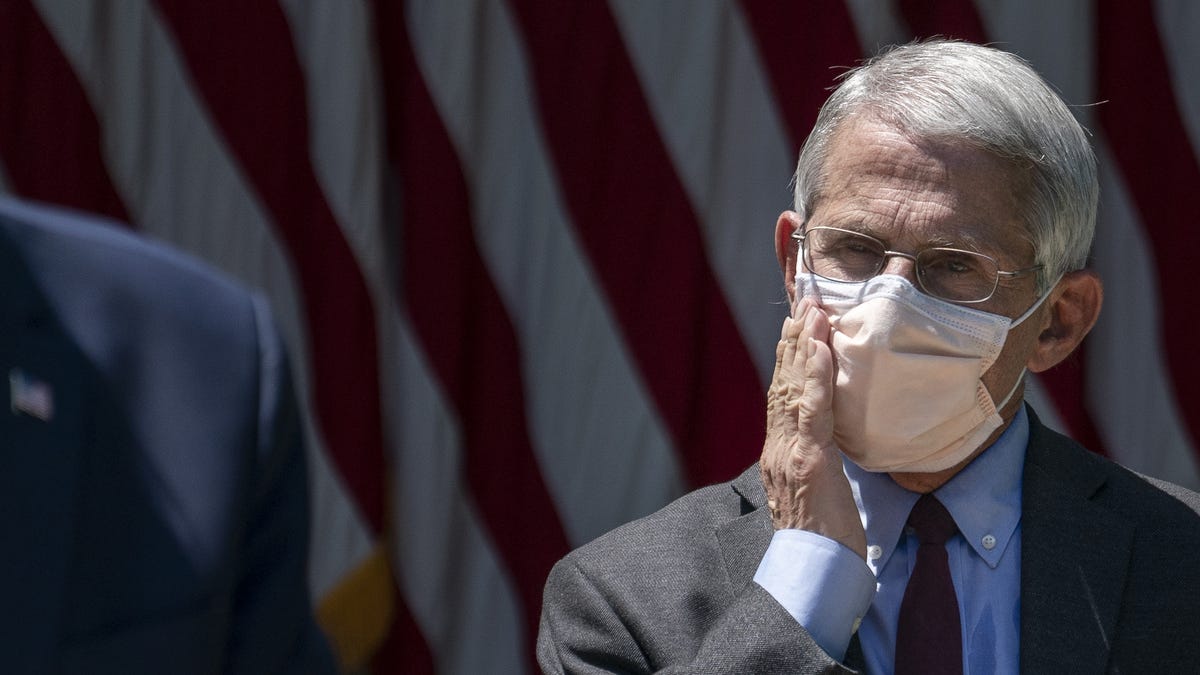 Dr. Anthony Fauci (R), director of the National Institute of Allergy and Infectious Diseases, looks on as U.S. President Donald Trump delivers remarks about coronavirus vaccine development in the Rose Garden of the White House on May 15, 2020 in Washington, DC.