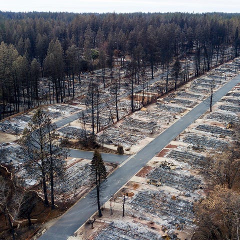 This file photo shows homes leveled by the Camp Fi