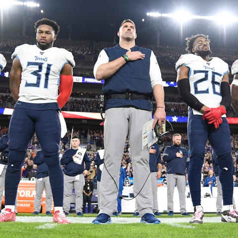 Tennessee Titans head coach Mike Vrabel and player