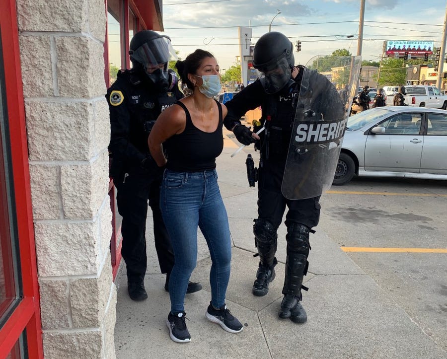 Des Moines Register reporter Andrea Sahouri is arrested by Des Moines police May 31 while covering a protest near Merle Hay Mall.