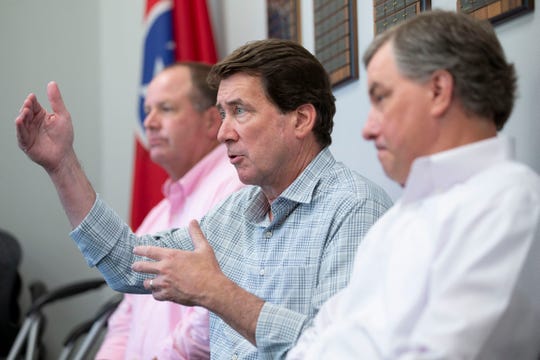U.S. Senate candidate Bill Hagerty (center) speaks to a group while seated between State Rep. Kevin Vaughan (left) and State Rep. Ron Gant on Monday, July 27, 2020, at the West Tennessee Home Builders Association in Collierville.