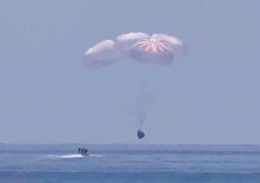 In this screen grab from NASA TV,  SpaceX 's Crew Dragon capsule spacecraft just before it splashes down in to the water after completing NASA's SpaceX Demo-2 mission to the International Space Station with NASA astronauts Robert Behnken and Douglas Hurley onboard, August 2, 2020 off the coast of Pensacola, Florida in the Gulf of Mexico. The Demo-2 mission is the first launch with astronauts of the SpaceX Crew Dragon spacecraft and Falcon 9 rocket to the International Space Station as   part of the agency's Commercial Crew Program. The test flight serves as an end-to-end demonstration of SpaceXs crew transportation system. Behnken and Hurley launched at 3:22 p.m. EDT on Saturday, May 30, from Launch Complex 39A at the Kennedy Space Center. A new era of human spaceflight is set to begin as American astronauts once again launch on an American rocket from American soil to low-Earth orbit for the first time since the conclusion of the Space Shuttle Program in 2011. 