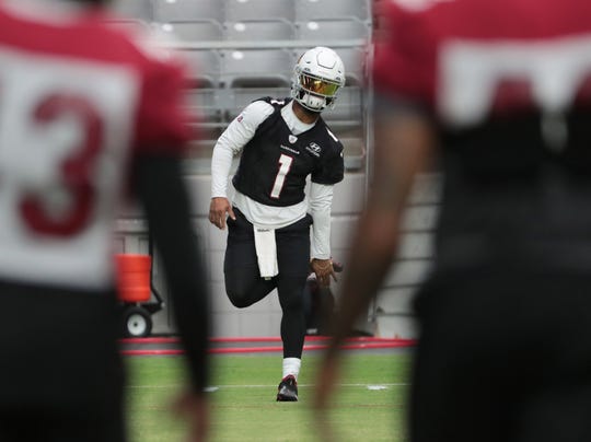 Arizona Cardinals quarterback Kyler Murray (1) stretches during training camp at State Farm Stadium Aug. 23, 2020.  