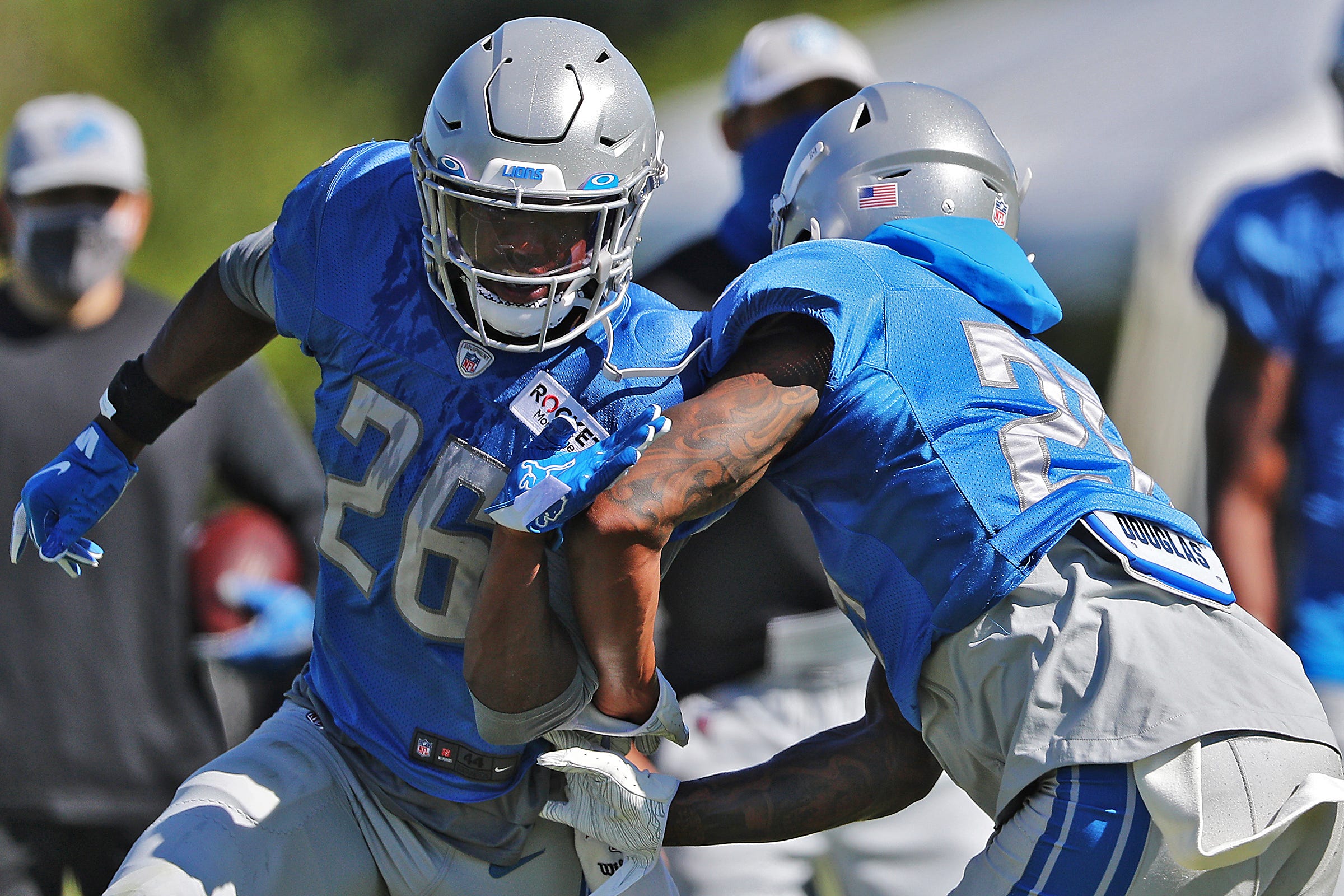 DETROIT, MI - OCTOBER 20: Detroit Lions RB Kerryon Johnson (33) readies  himself to stiff arm Minnesota Vikings S Anthony Harris (41) during NFL game  between Minnesota Vikings and Detroit Lions on