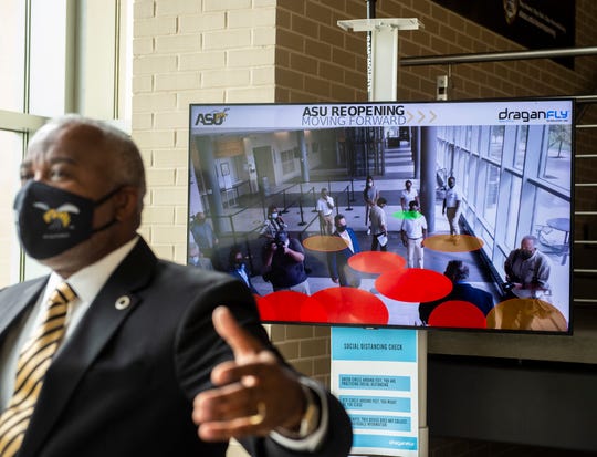 ASU Quinton Ross shows off social distancing technology at the Hardy Student Center on Alabama State University campus in Montgomery, Ala., on Tuesday, Sept. 1, 2020.
